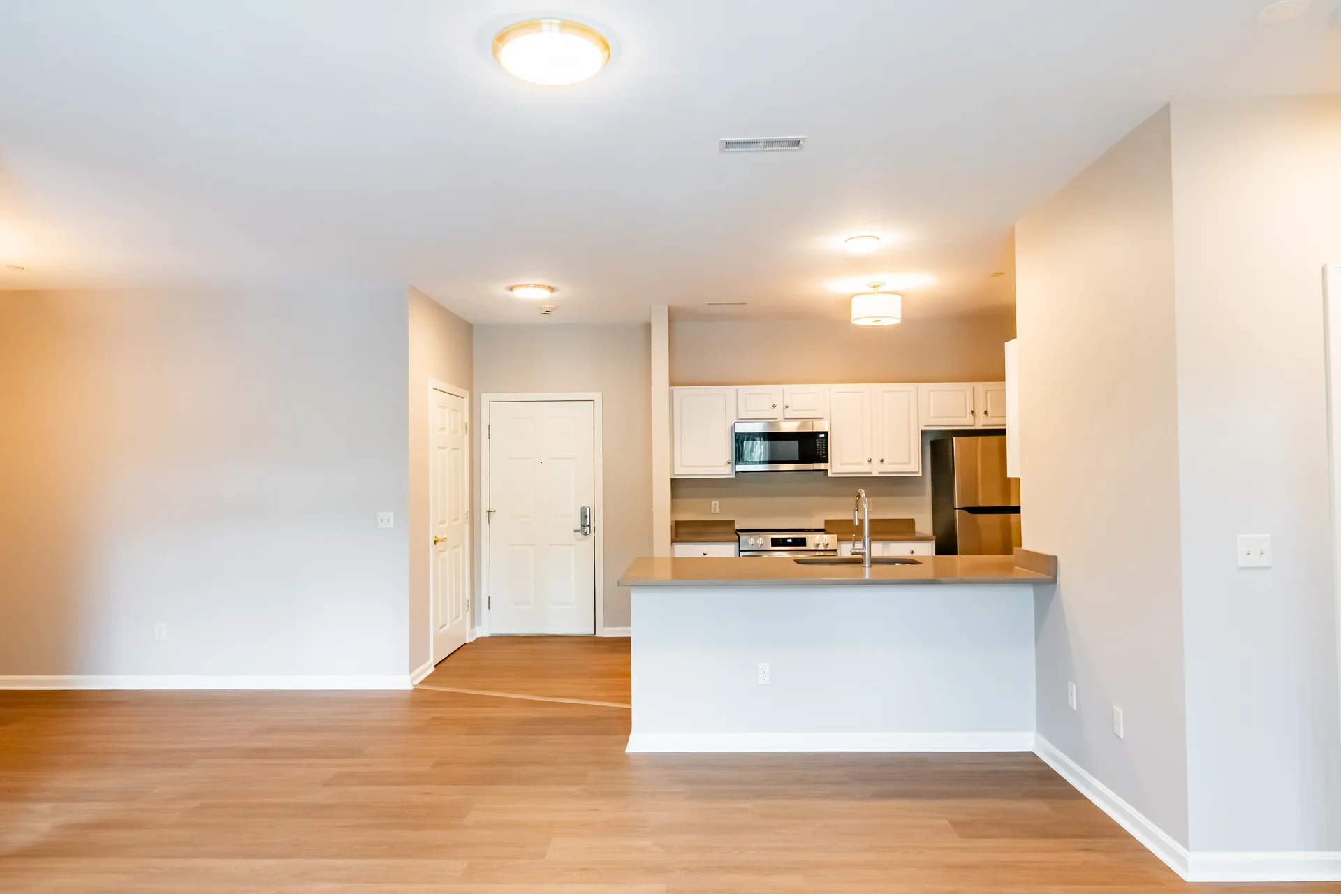 Open-concept great room and dining area in a renovated Chestnut Park home.
