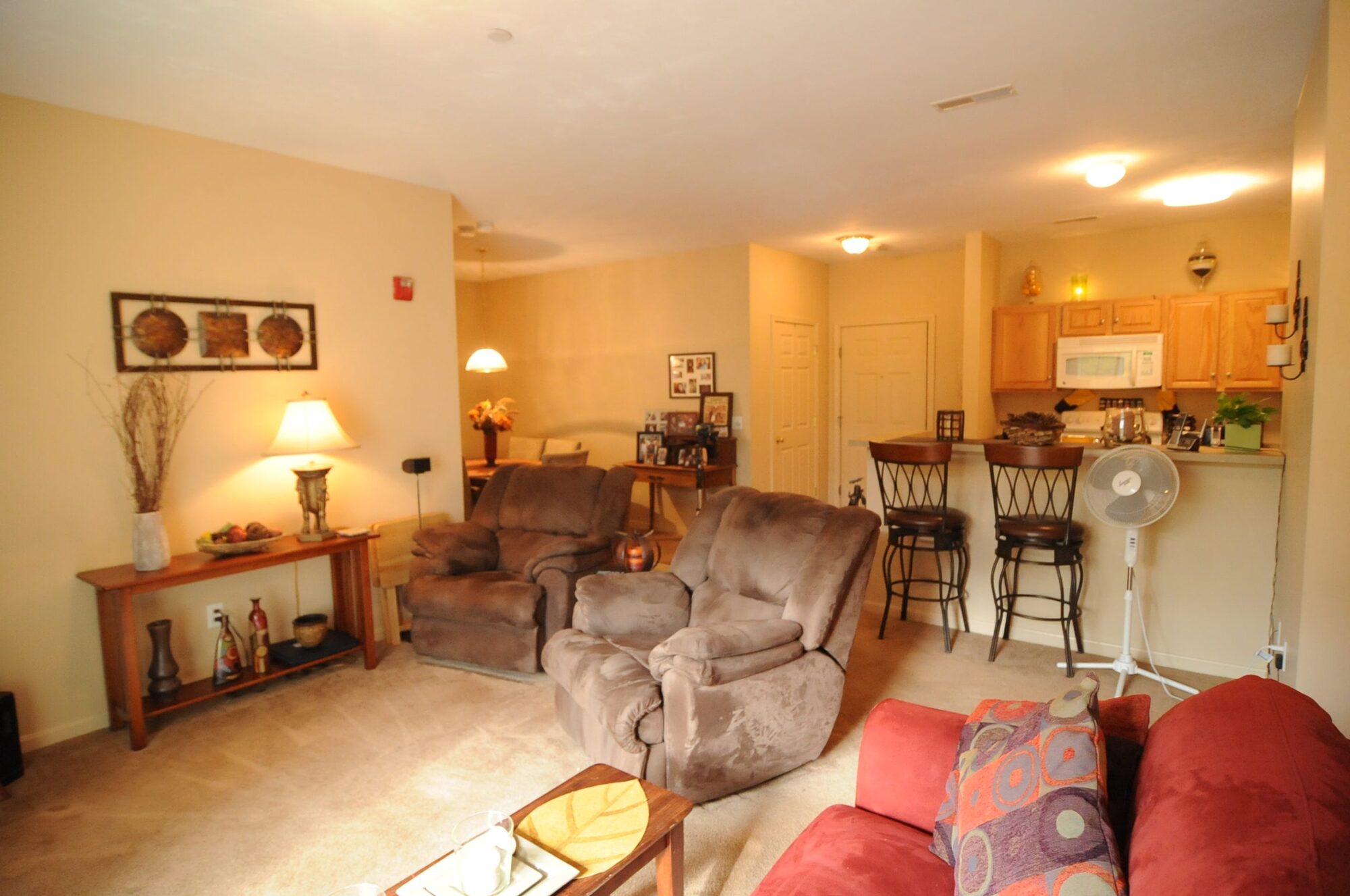 Open-concept great room and dining area with a kitchen breakfast bar.